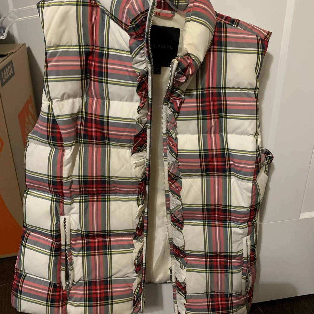 Gently used but loved puffer vest with zip front and zipped pockets.